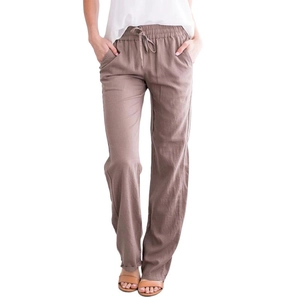Detail of drawstring elastic waist and texture on taupe cotton linen wide leg trousers