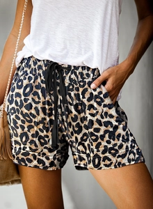 Detailed view of leopard print summer shorts with elastic waistband and drawstrings