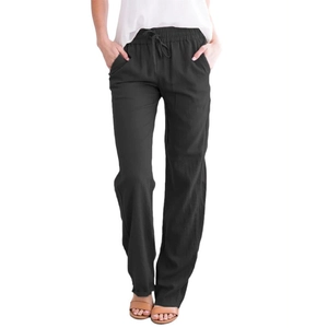 Detail of black cotton linen trousers showing elastic drawstring waist and side pockets