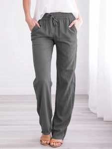 Detailed view of dark grey cotton linen trousers with drawstring waist and side pockets