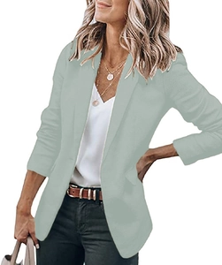 Close-up of elegant single-breasted sage green blazer with classic notched lapels for women