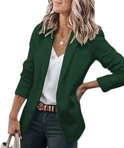 Detailed view of dark green blazer with classic notch lapels and single button closure