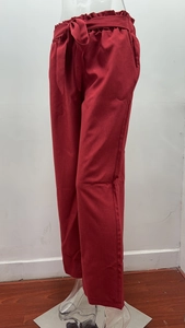 Detail of high waisted wide leg trousers with elastic waist and stylish bow tie