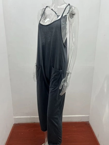 Detail view of adjustable straps and side pockets on dark grey loose jumpsuits