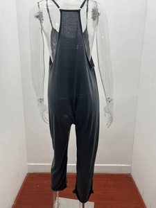 Detail of black backless jumpsuit with spaghetti straps and loose fit casual style