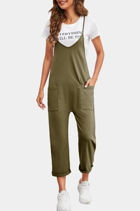 Detail view of olive green jumpsuit featuring large patch pockets and cuffed hem details
