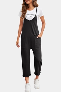 Detail view of black casual overall with functional front pockets and thin shoulder straps