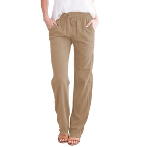 Detail of khaki cotton linen pants featuring high waist drawstring and side pockets
