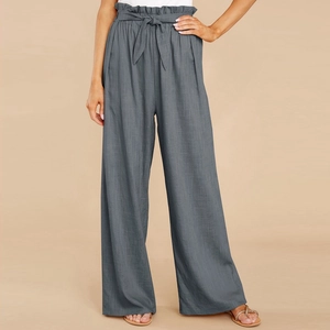 Close-up of paper-bag waist with fabric belt on gray linen wide leg trousers