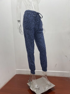 Detail of blue leopard print joggers with drawstring waistband and ribbed ankle cuffs