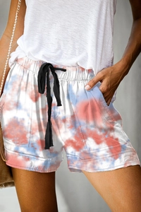 Detailed view of women's tie-dye casual shorts with elastic drawstring waist and pockets