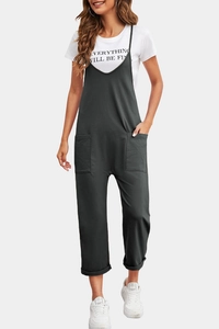 Detail of grey casual overalls with side pockets paired with a white printed T-shirt