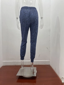 Detailed view of leopard print jogger pants featuring an elastic drawstring waistband