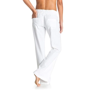 Detailed back view of white linen wide-leg pants showing elastic waist and back pockets