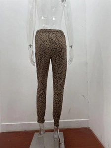 Detail view of the leopard print joggers showing elastic waist and cuffed hem from the back