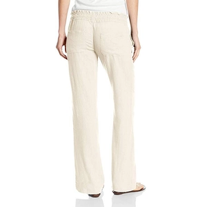 Detail view of high-waist linen trousers showing elastic waistband and back pockets