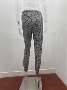 Detail of grey leopard print joggers showing elastic waistband and ribbed ankle cuffs