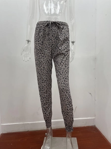 Detail view of women's leopard print joggers with drawstring waist and elastic cuffs