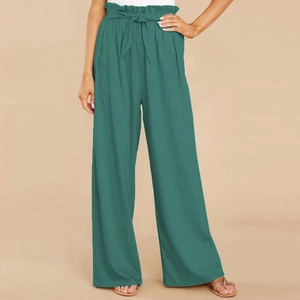 Detail of high-waisted paperbag linen pants with a decorative tie belt in dark teal green