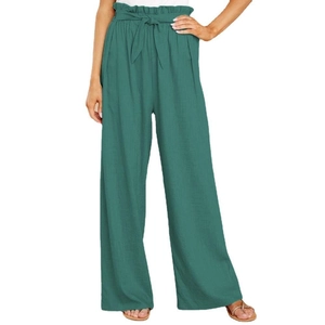 Detail of high waisted dark green cotton linen trousers with paperbag waist and bow belt