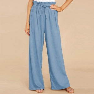 Detail of high waisted paperbag cotton linen wide leg trousers in light blue with waist belt