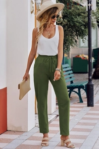 Detail of high waist drawstring elastic waistband on olive green wide leg trousers