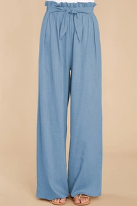 Detail of light blue paperbag waist wide leg trousers with a self-tie matching belt