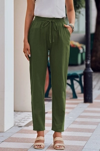 Close-up of army green cotton linen wide-leg pants with drawstring waist and side pockets