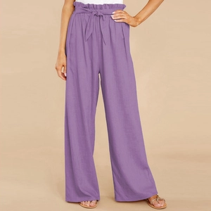 Detail of purple paperbag waist trousers showing linen texture and matching bow belt
