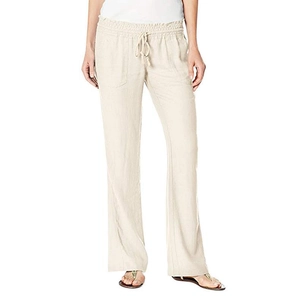 Women's loose linen trousers with elastic drawstring waist in natural oatmeal color