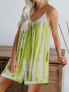 Close-up of green and white vertical tie-dye print on casual summer sleeveless jumpsuit
