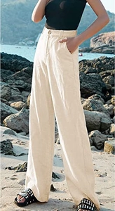 Dettaglio dei pantaloni larghi in lino color crema a vita alta con tasca e bottone da donna