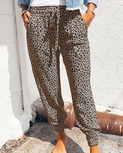 Detail view of high waist leopard print joggers with drawstring and elastic cuffs