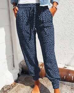 Detail of high waisted leopard print joggers with drawstring waist and side pockets