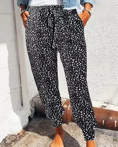 Detail of high waist leopard print jogger pants with adjustable drawstring and side pockets