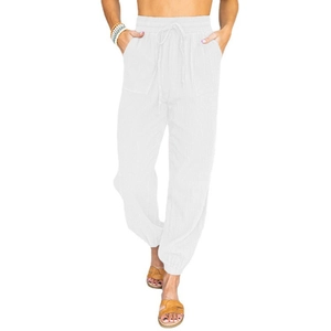 Detail view of women's high-waisted white joggers with drawstring and elastic ankle cuffs