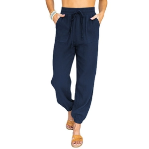 Detailed texture of navy blue cotton linen high waist jogger pants with drawstring