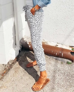 Detail of loose leopard print joggers with drawstring waist and ribbed ankle cuffs