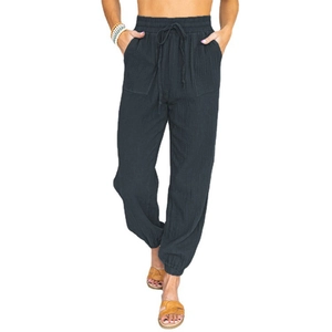Detailed view of elastic high waist with drawstring and front patch pockets on dark gray joggers