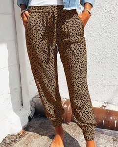 Detail of leopard print casual joggers with elastic drawstring waist and cuffed ankles