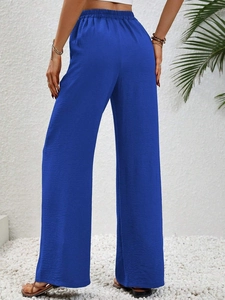 Vista posteriore dei pantaloni a gamba larga a vita alta blu reale con drappeggio