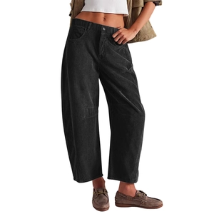 Close-up of black corduroy trousers with high elastic waist and vertical rib texture