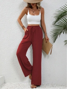 Pantaloni larghi donna color ruggine con vita elastica e coulisse in tessuto strutturato