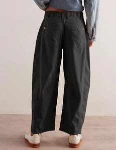 Detail view of high waist corduroy trousers featuring elastic waistband and back pockets