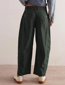 Detail view of high waist corduroy pants showing back pocket and ribbed texture
