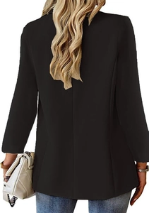 Back view of a slim black blazer for women paired with denim and a white chain bag