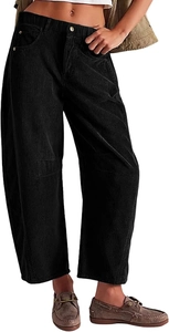 Detail of high waisted black corduroy wide leg pants with elastic waist and ribbed texture