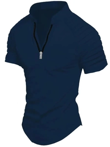 Detail of navy blue polo shirt featuring quarter-zip V-neck and pleated shoulder design
