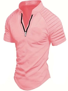 Close-up of pink men's polo shirt featuring V-neck zipper and pleated sleeve details