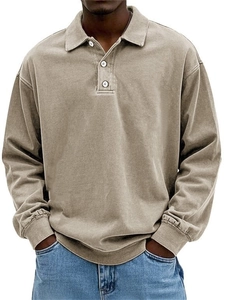 Detail view of khaki long sleeve polo shirt with ribbed cuffs and washed cotton texture